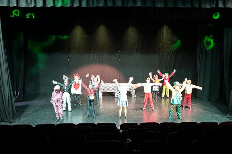 Cheer dancers with pom-poms performing routine